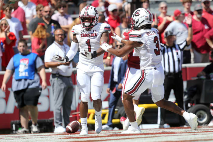 Sep 10, 2022; Fayetteville, Arkansas, USA; South Carolina Gamecocks running back MarShawn Lloyd (1) celebrates with Antewane Wells Jr. (3) after rushing for a touchdown in the second quarter against the Arkansas Razorbacks at Donald W. Reynolds Razorback Stadium. Credit: Nelson Chenault-USA TODAY Sports